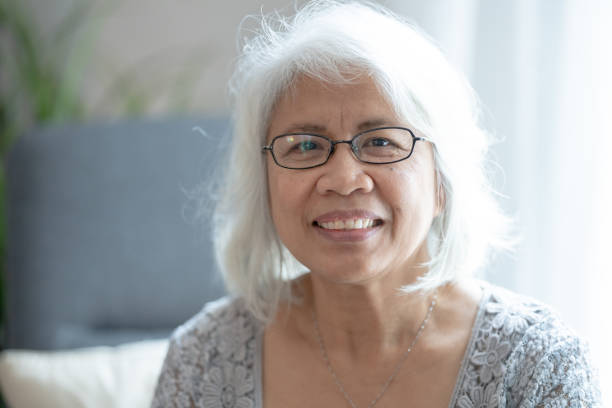 istock Senior Filipino female smiling at camera 1293373330