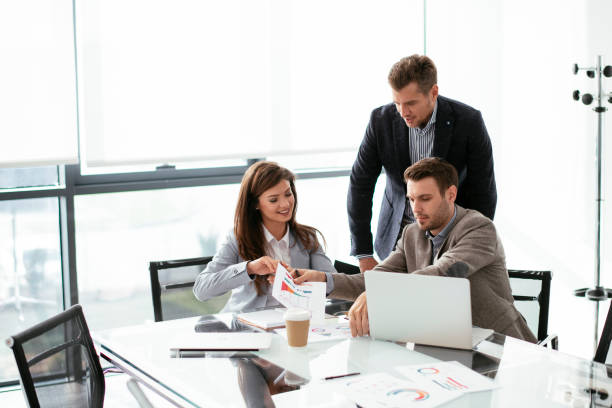 istock Business people discussing new business projects in the office. 1293374349