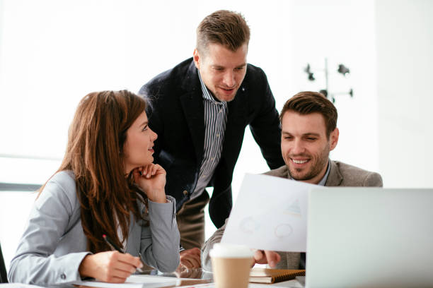 istock Business people discussing new business projects in the office. 1293374366