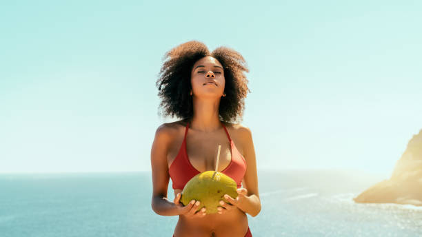 Brazilian girl with coconut, resort