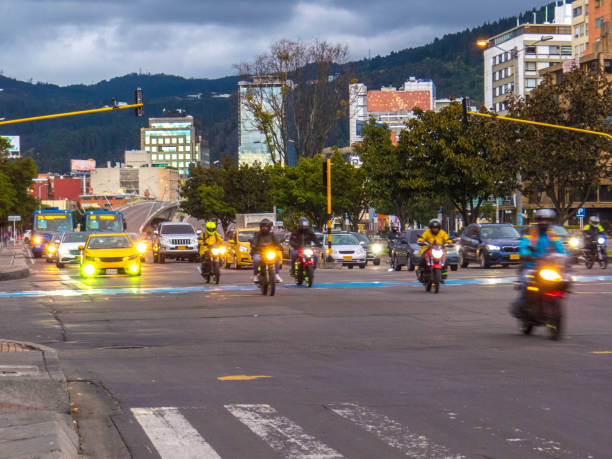Cars and motorcycles with traffic lights in Bogota - Colombia stock photo