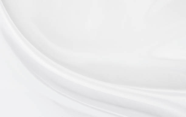 istock White gray satin texture that is white silver fabric silk background with beautiful soft blur pattern natural. 1293379472