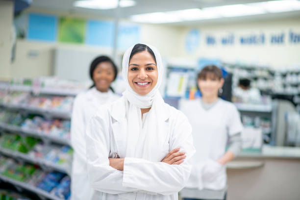 istock Beautiful smiling muslim pharmacist 1293382940