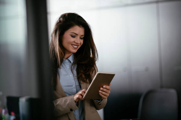 istock Beautiful businesswoman using a digital tablet 1293387018