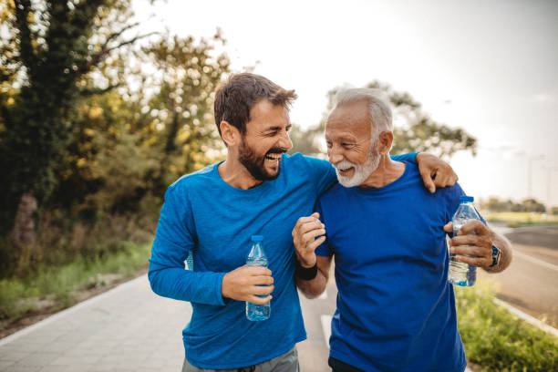 Two men exercising Two men exercising outdoors geriatrics stock pictures, royalty-free photos & images