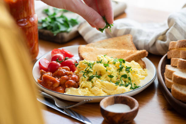 istock Serving scrambled eggs with bread toast and baked beans 1293404174