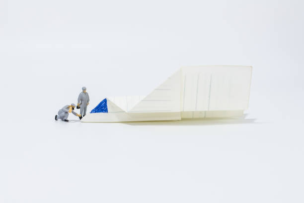 istock Close up engineer with paper airplane isolated on white background 1293405427