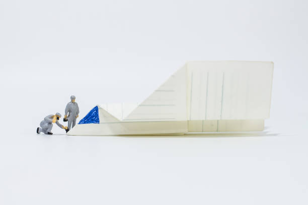 istock Close up engineer with paper airplane isolated on white background 1293405464