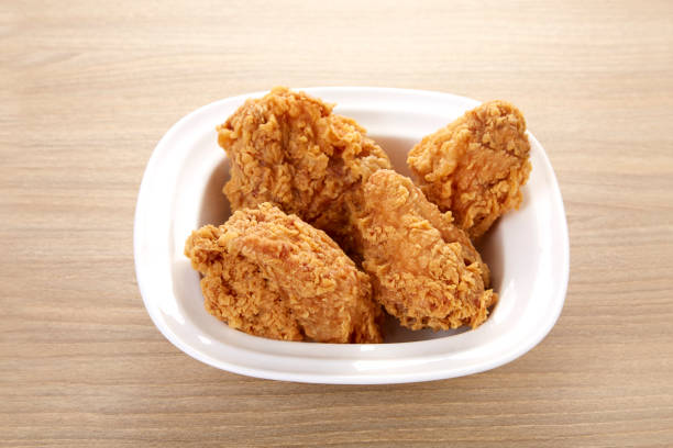istock crispy fried chicken in white dish on wood table 1293406286