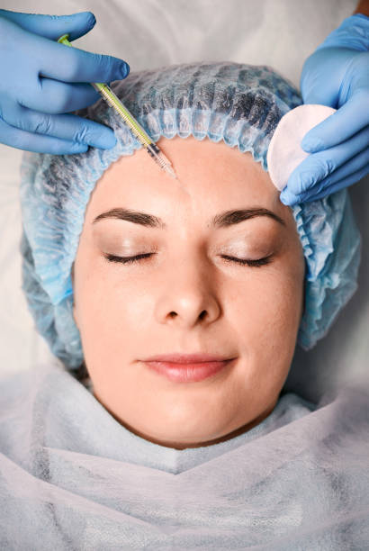 istock Female client getting beauty injection at wellness center. 1293406868