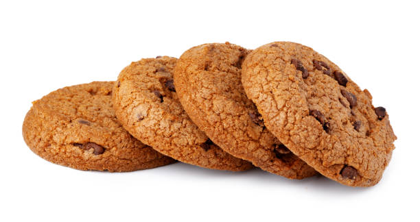 istock Pile of chocolate chip cookies isolated on white background 1293411252