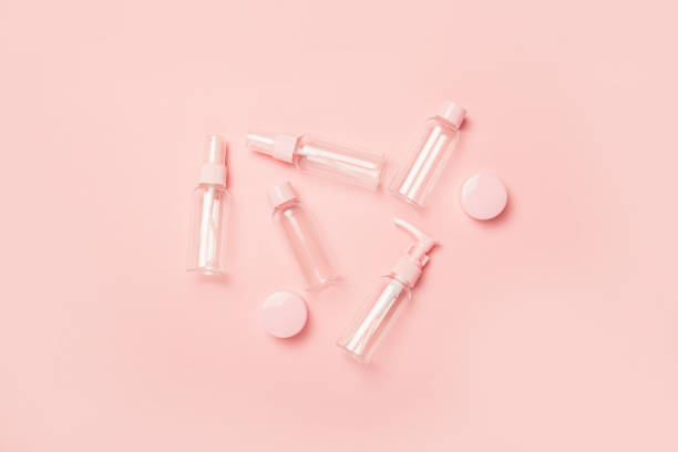 istock Empty tubes for cosmetics on a pastel pink background. Flat lay, top view. Banner 1293412294
