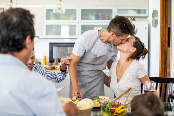 istock Couple kissing at dining table 1293416917
