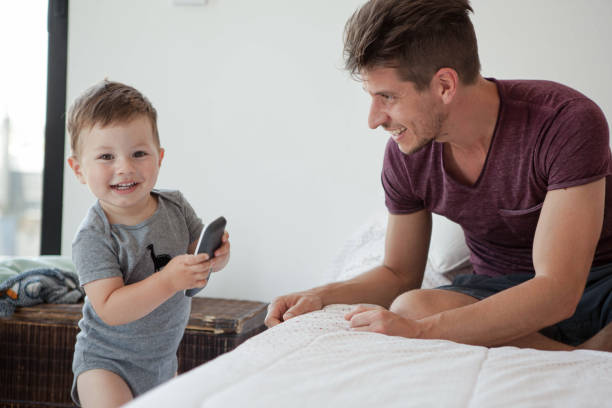 istock Father and son in bedroom 1293417548