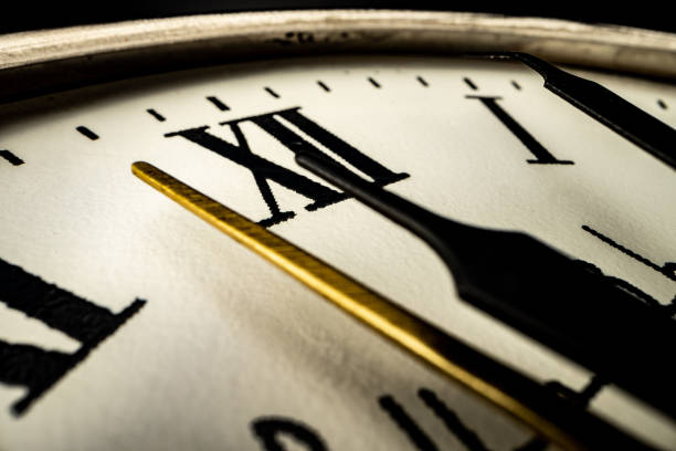 istock Old metal watch dial in dark macro photo 1293417636