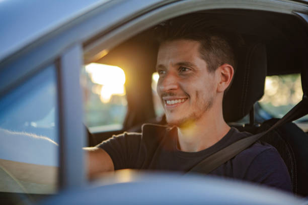 istock Happy Man sitting in car 1293417861