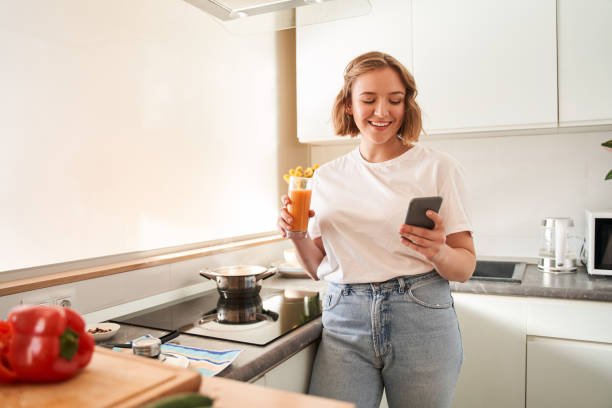 istock Woman looking recipes at the smartphone 1293417962