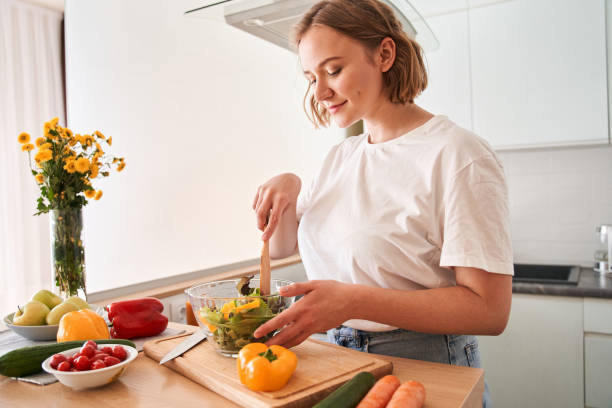 istock Woman is cutting ingredients on table 1293417995