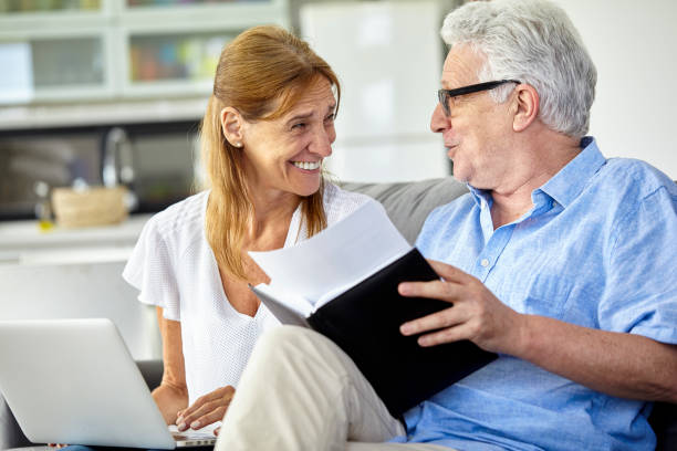 istock Senior couple doing home finances together 1293418059