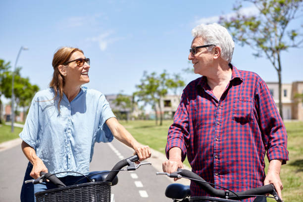 istock Couple cycling on street 1293418105