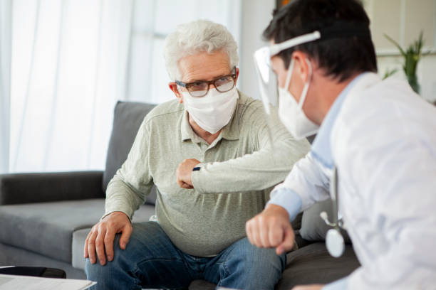 istock Doctor visiting senior patient at home 1293418479