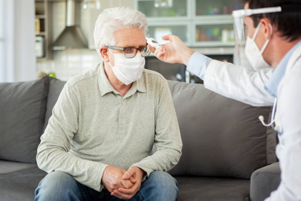 istock Doctor visiting senior patient at home 1293418480
