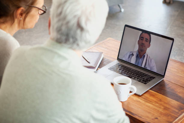 istock Mature couple having video call with doctor 1293418501