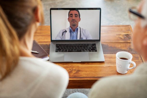 istock Couple having video call with doctor 1293418526