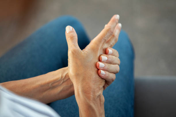 istock Woman massaging hand with pain 1293418769
