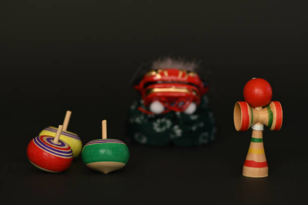 istock Kendama toy, spinning tops and lion dance on black background 1293419799
