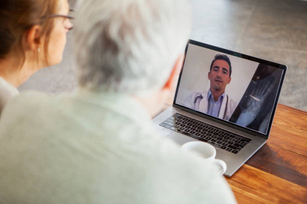 istock Couple having video call with doctor 1293420928