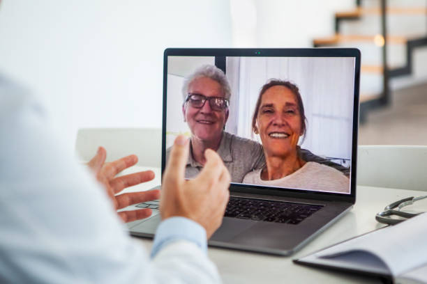 istock Doctor having video call with couple 1293420948