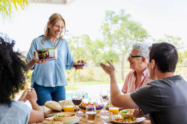 istock Mature woman serving food 1293421870