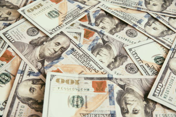 istock lots of hundred-dollar bills for the background 1293421887