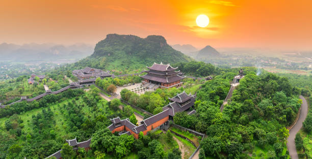 Sunset landscape of Bai Dinh temple complex from above Sunset landscape of Bai Dinh temple complex from above is one of the biggiest and largest temple Southeast Asia in Ninh Binh, Vietnam. pagoda photos stock pictures, royalty-free photos & images