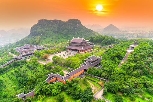 Sunset landscape of Bai Dinh temple complex from above is one of the biggiest and largest temple Southeast Asia in Ninh Binh, Vietnam.