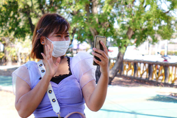 istock new normal lifestyle. woman using smart phone. 1293422410