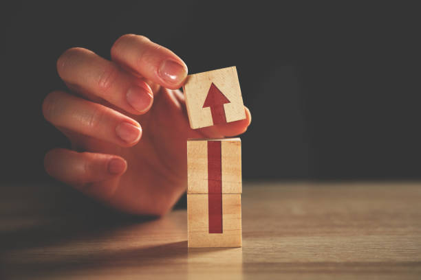 istock Business growth and development concept with arrow on wooden blocks 1293425899