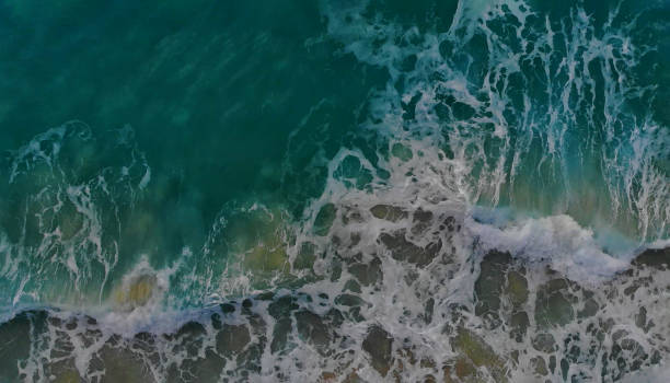 istock Turquoise ocean water wave view from height to the shining and sparkling surface. 1293425968