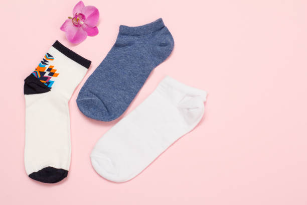 istock Women socks on pink background. Top view. 1293429082