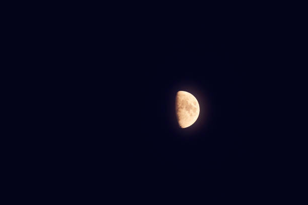 istock Half Moon photographed through a long focal telescope. 1293430840