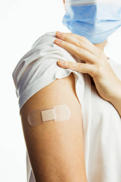 istock making injection of vaccine in shoulder white background 1293432324