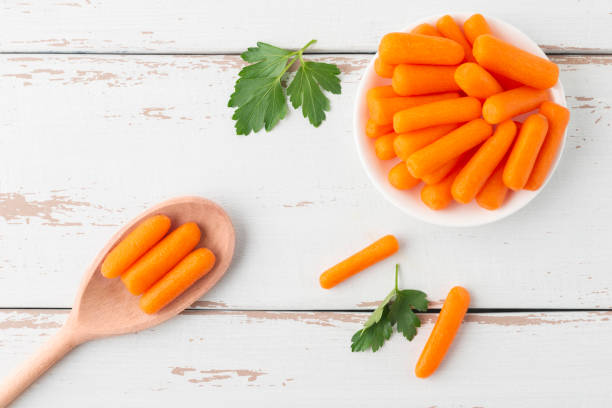 istock Small peeled pieces of carrot in plate 1293433962