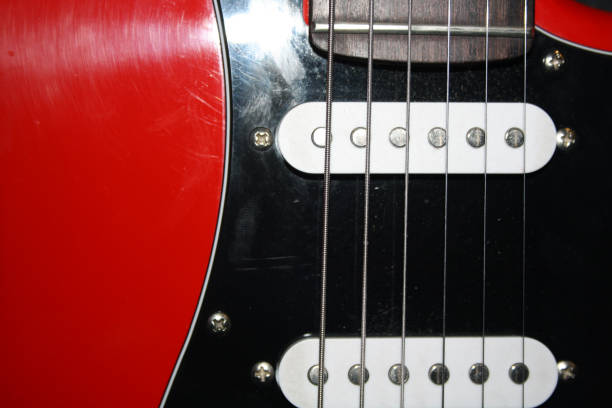 istock Guitar strings, light wood guitar body. 1293435351