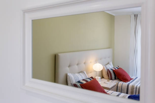 istock Modern bedroom, which is reflected in the mirror. European hotel design and inside. 1293437154