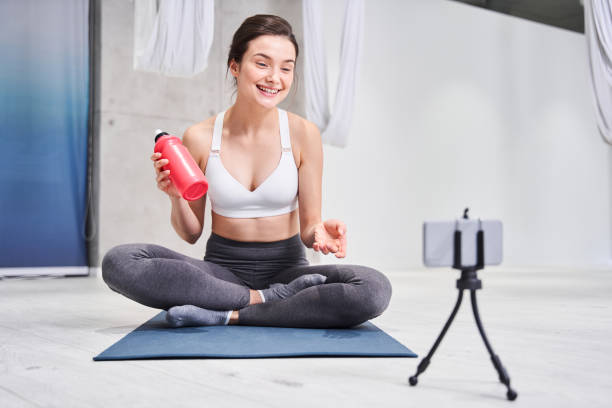 istock Woman holding bottle with water 1293437877