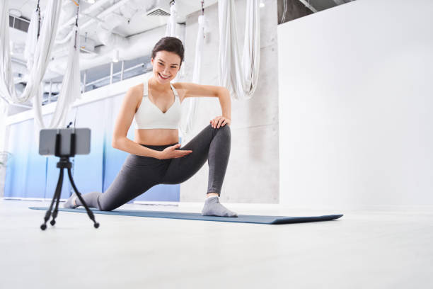 istock Woman vlogger stretching her leg 1293437879
