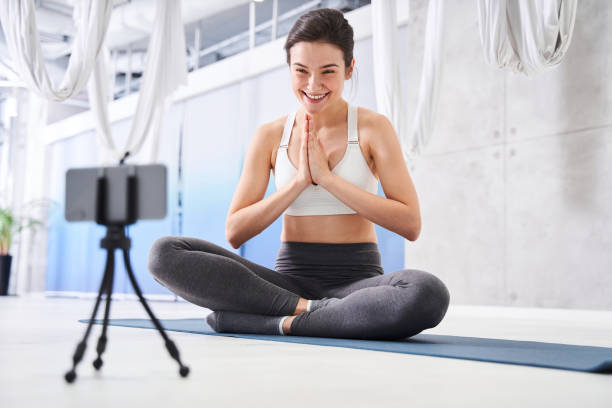 istock Woman sitting at the lotus pose 1293437885