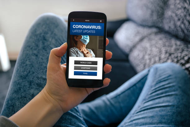 istock Covid-19 latest news concept on mobile screen 1293439109
