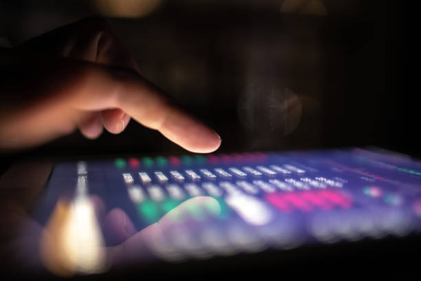istock Male hand using digital tablet / smartphone at night 1293441203